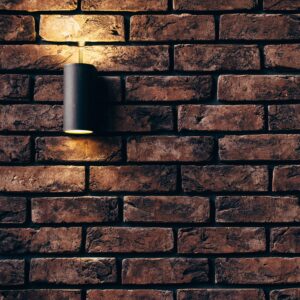 Contemporary brick wall design featuring a sleek accent light.